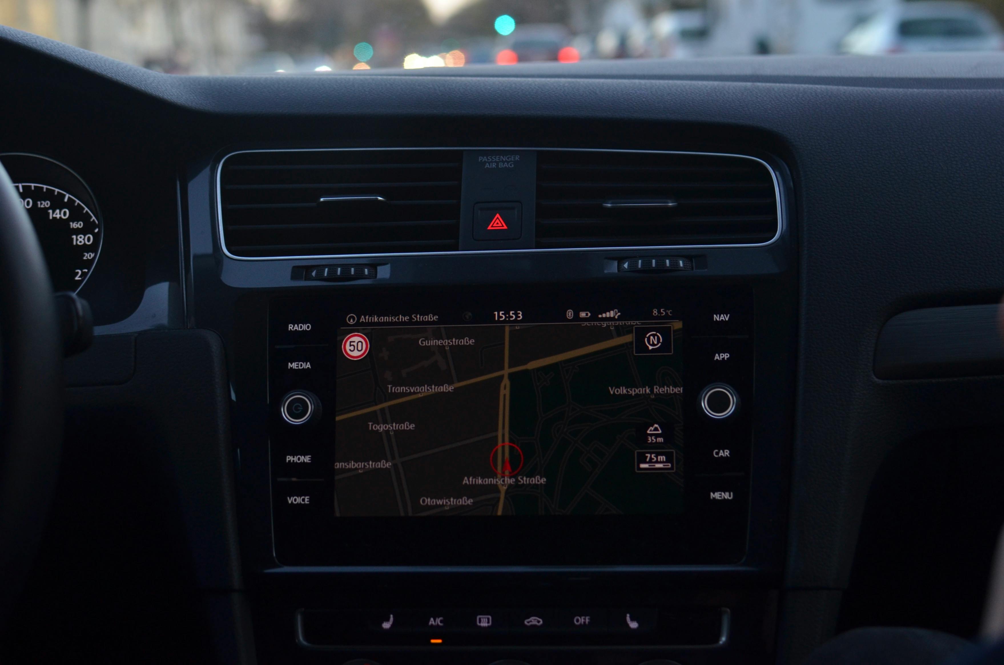 Car dashboard GPS navigation screen showing route tracking
